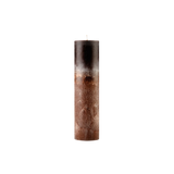 Textured cylindrical candle on a white background
