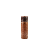 Brown candle with textured surface on a white background