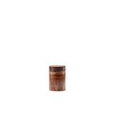 Textured cylindrical candle on a white background
