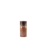 Decorative candle with a textured surface on a white background