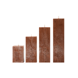 Set of four rectangular brown candles on a white background