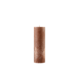 Brown textured candle on a white background