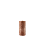 Brown textured candle on a white background