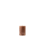 Brown textured candle on a white background