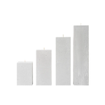 Set of four rectangular concrete candles on a white background