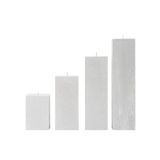 Set of four rectangular concrete candles on a white background
