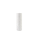 White pillar candle on a white background