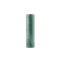 Green cylindrical candle on a white background