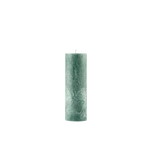 Green textured candle on a white background