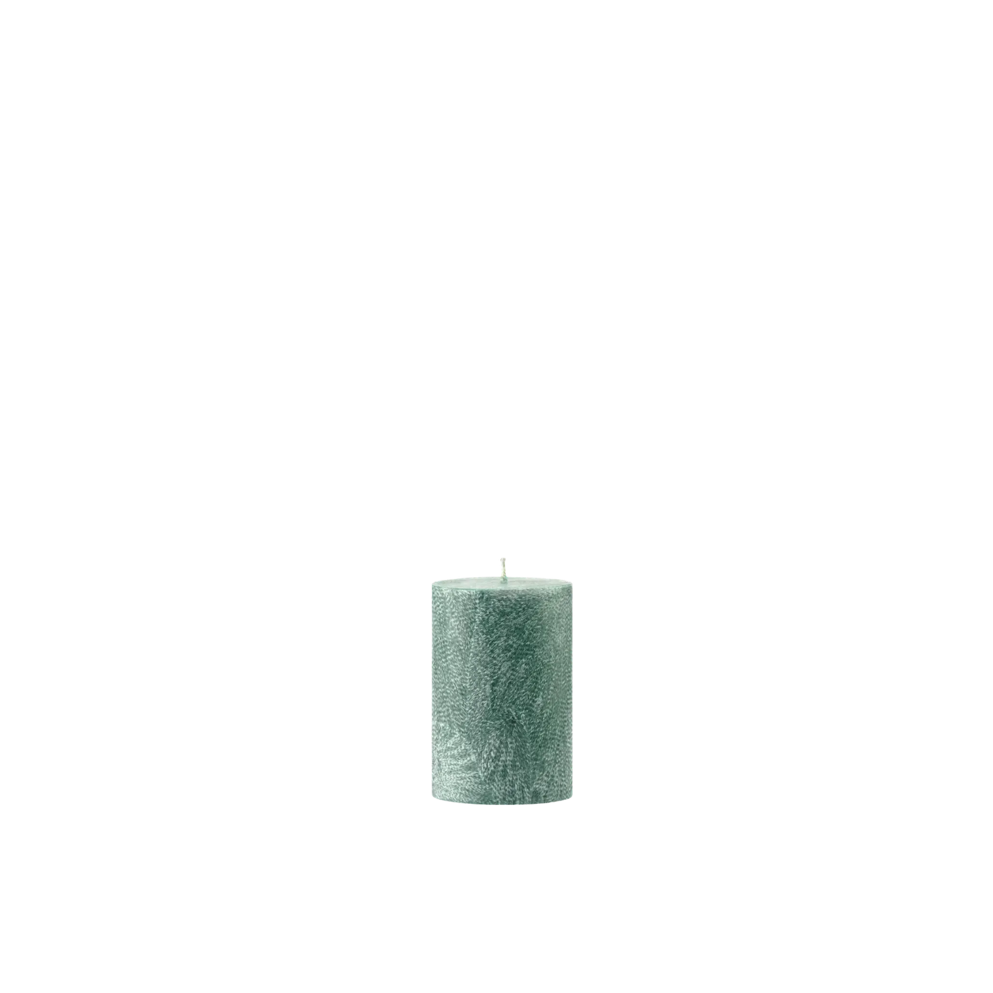 Green textured candle on a white background