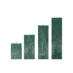 Set of four green textured candles on a white background