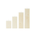 Set of four cream-colored rectangular candles on a white background