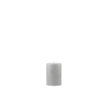 Gray textured candle on a white background