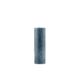 Textured blue candle on a white background