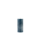 Blue candle on a white background