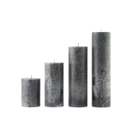Set of five textured gray candles of different sizes on a white background