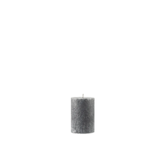 Textured gray candle on a white background
