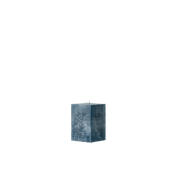 Blue textured square candle on a white background