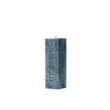 Blue textured square pillar candle on a white background