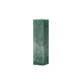 Green textured rectangular candle on a white background
