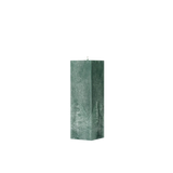 Green textured square pillar candle on a white background