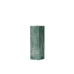 Green textured square pillar candle on a white background
