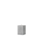 Gray textured cube candle on a white background