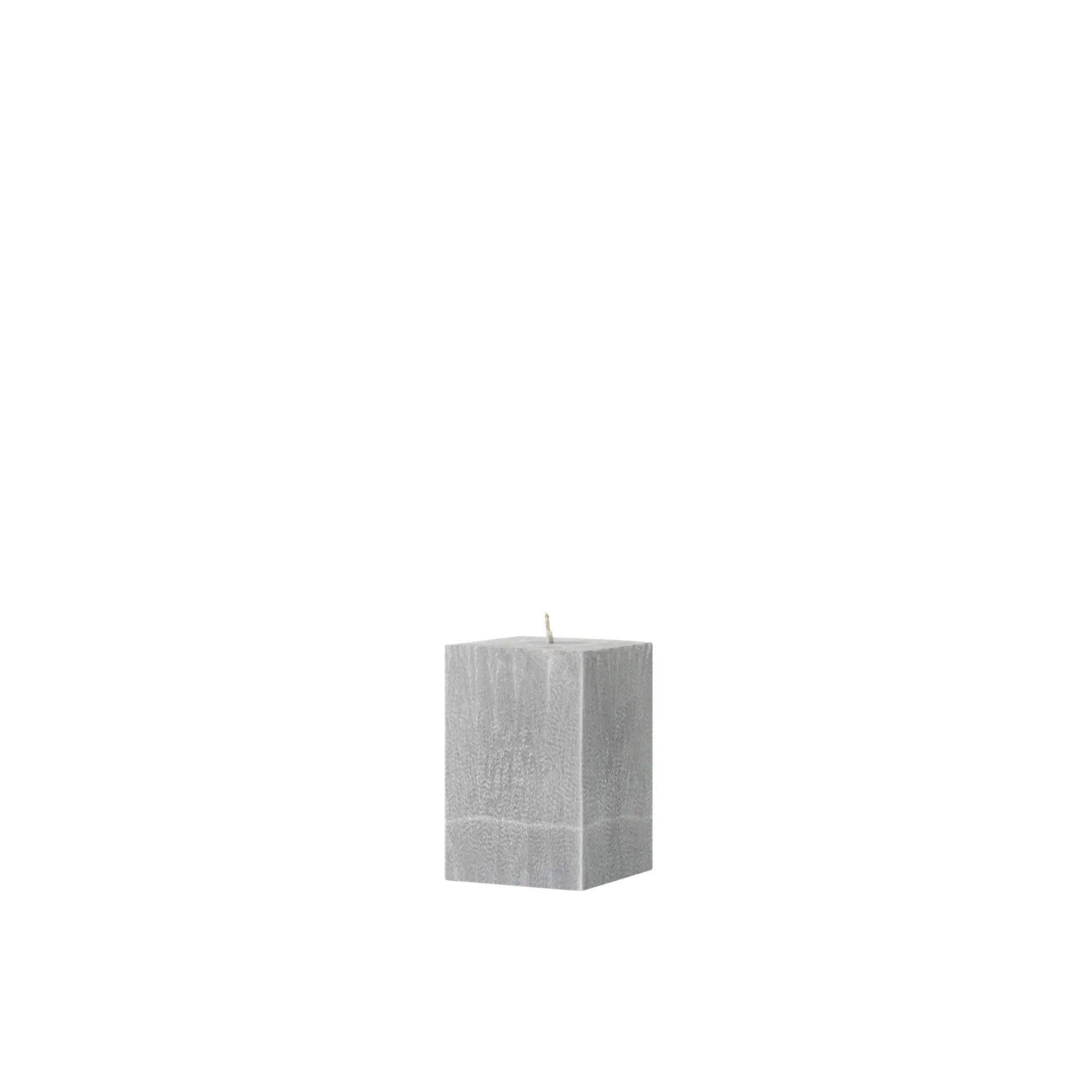 Gray textured cube candle on a white background