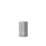 Gray textured square pillar candle on a white background
