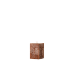 Square brown candle on a white background