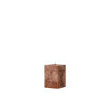 Square brown candle on a white background