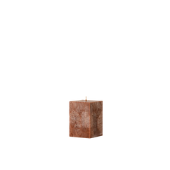 Square brown candle on a white background