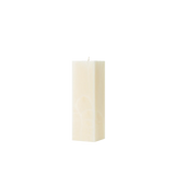Rectangular cream candle on a white background
