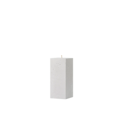 White rectangular candle on a white background