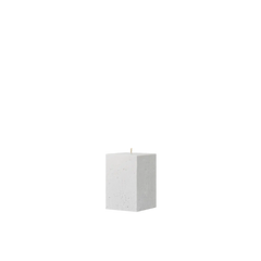 White square candle on a white background