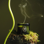 Candle with smoke on a dark background
