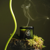 Candle with smoke on a dark background
