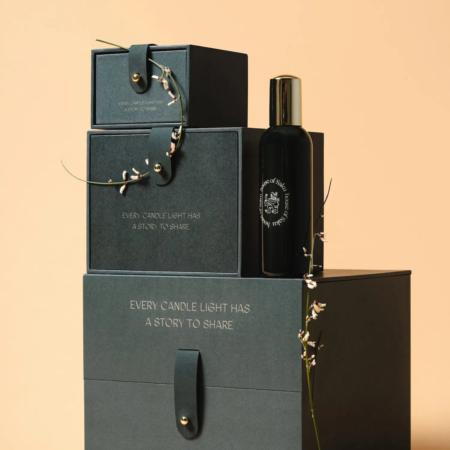 Candle and packaging with decorative elements on a beige background