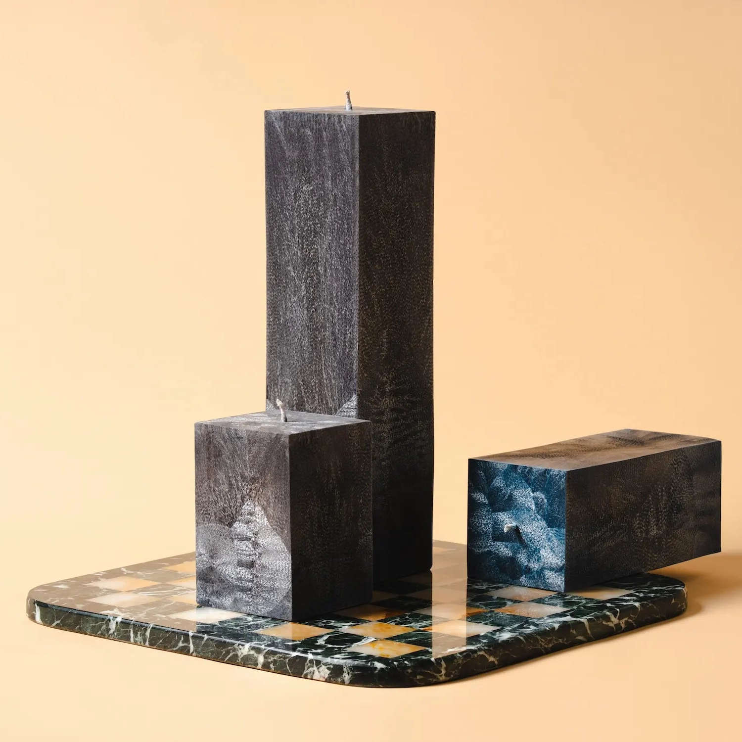 Marble candle holders on a beige background