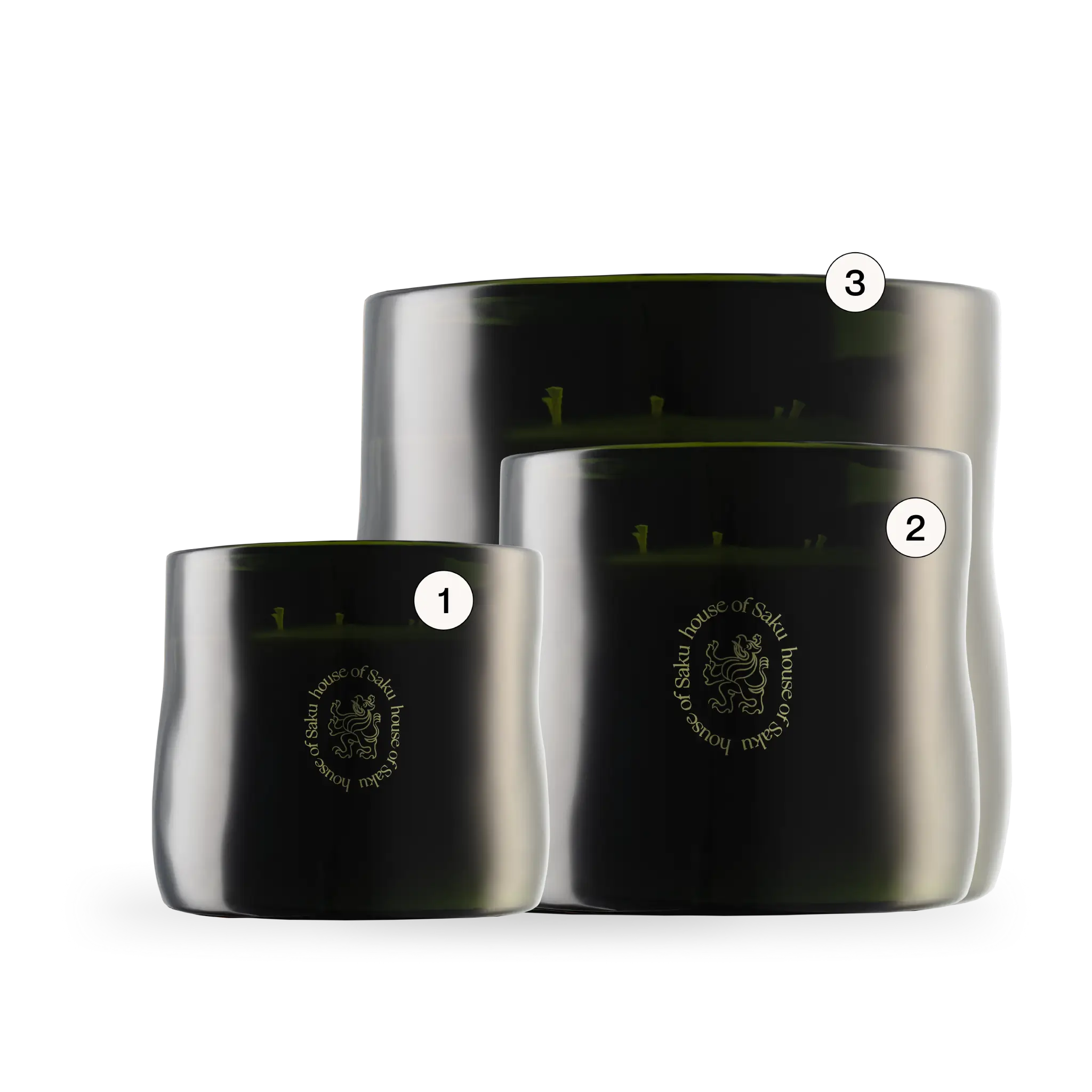 Three black candles with silver lids on a white background